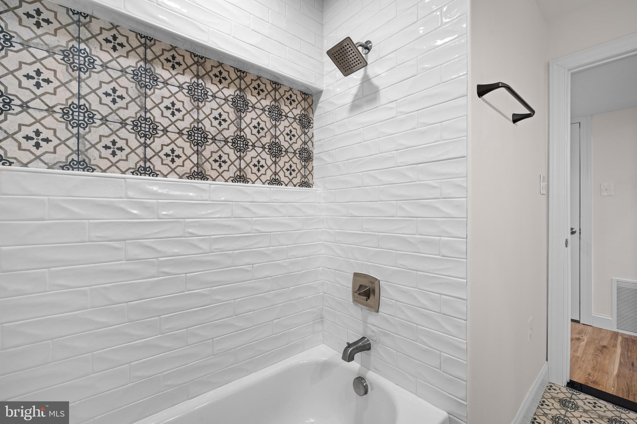 1711 Janvier Road Williamstown, NJ 08094 - Photo 17 of 24 a bathroom with a bathtub and a shower