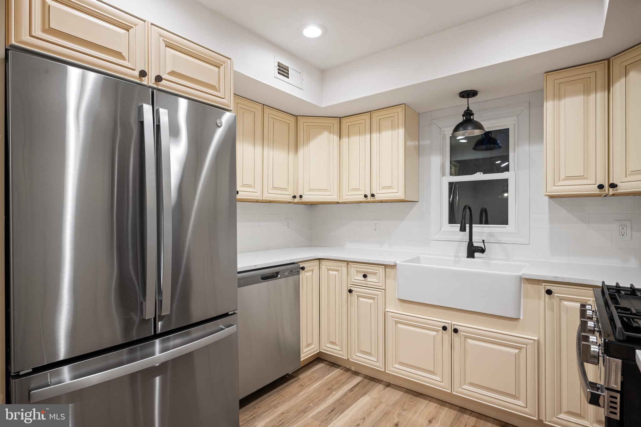 1711 Janvier Road Williamstown, NJ 08094 - Photo 9 of 24 a kitchen with white cabinets and refrigerator