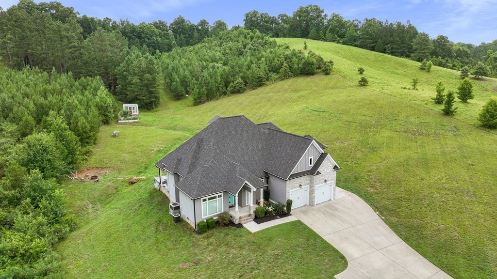 870 Morgan Road Charleston, TN 37310 - Photo 54 of 70 a aerial view of a house with a yard and trees