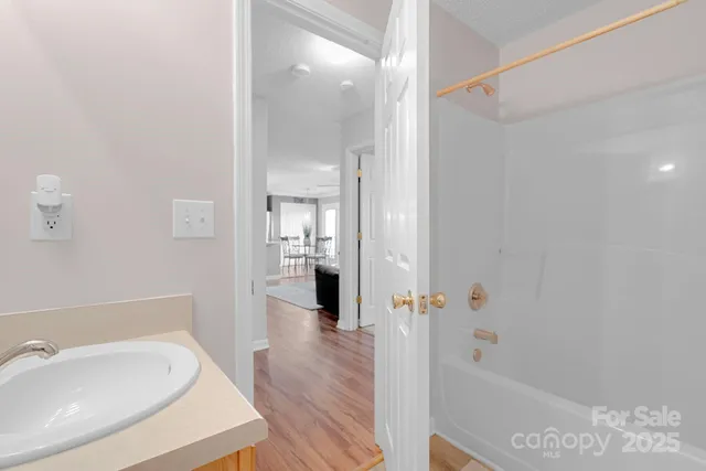 a spacious bathroom with a bathtub and shower