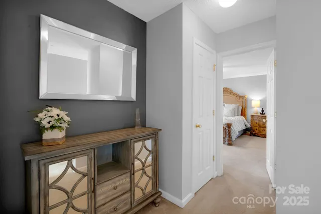 a view of hall way with furniture