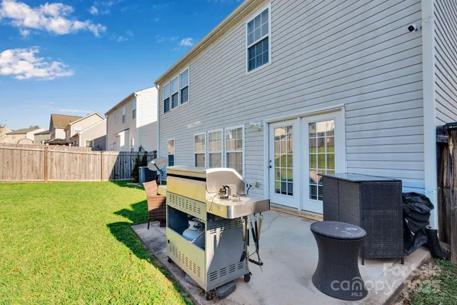 a view of a patio with couches chairs and a fire pit