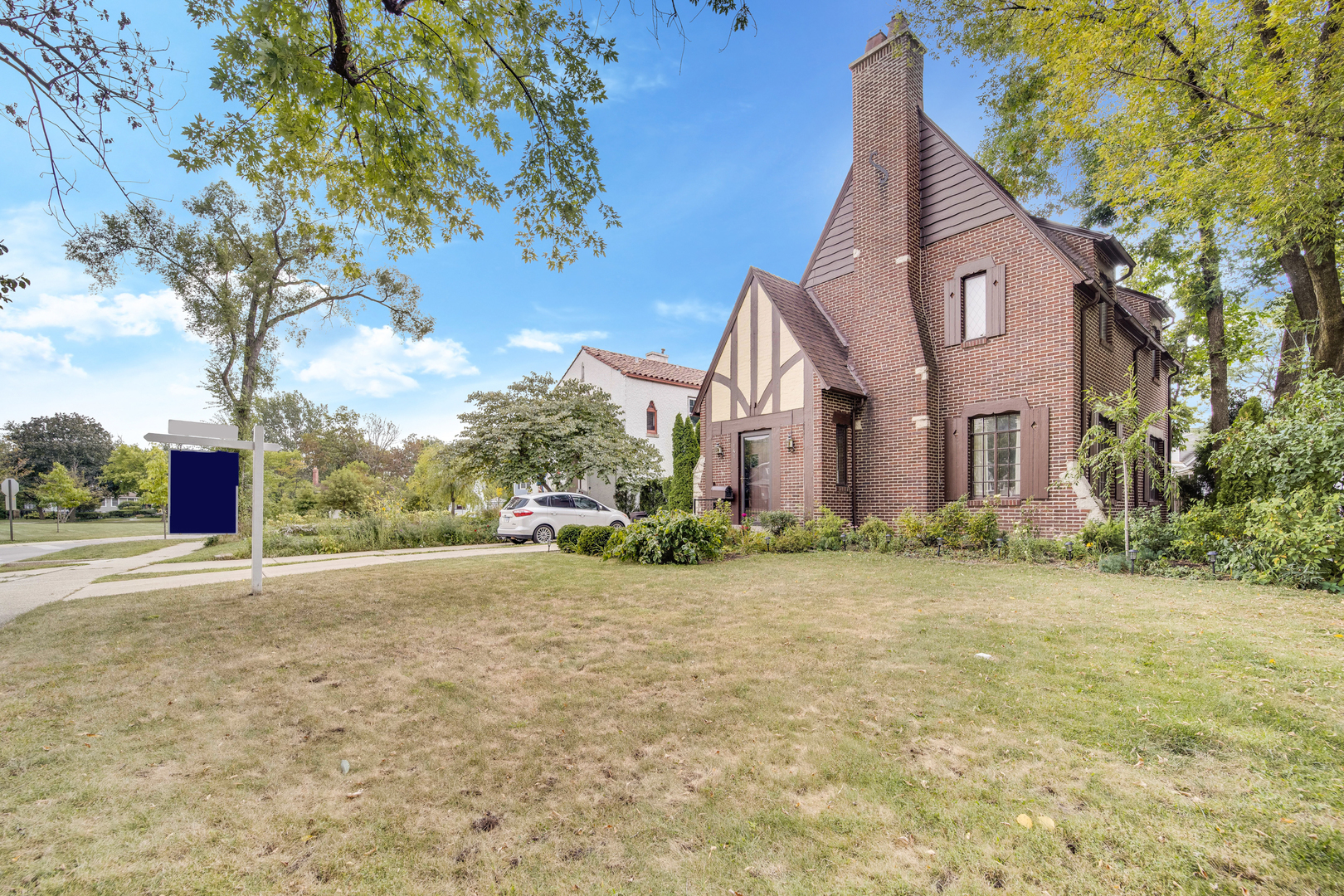 141 North Delaplaine Road Riverside, IL 60546 - Photo 2 of 19 a view of a house with a yard and garage