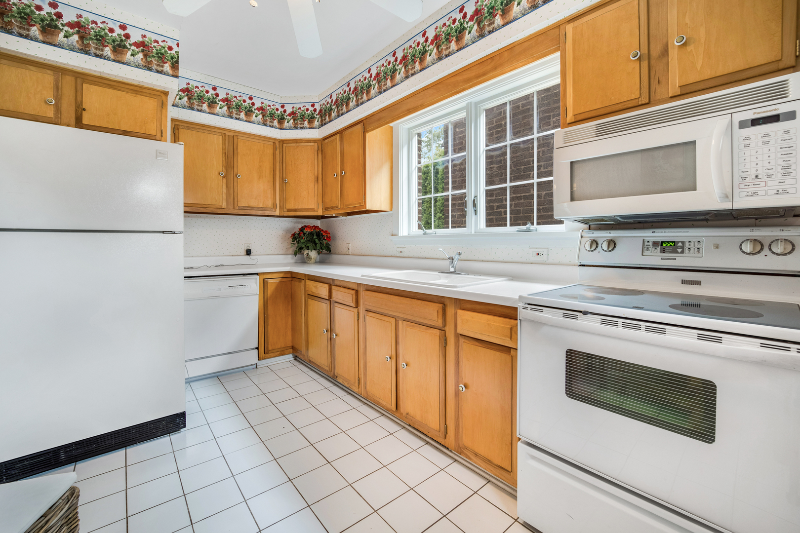 141 North Delaplaine Road Riverside, IL 60546 - Photo 11 of 19 a kitchen with stainless steel appliances a stove sink and cabinets