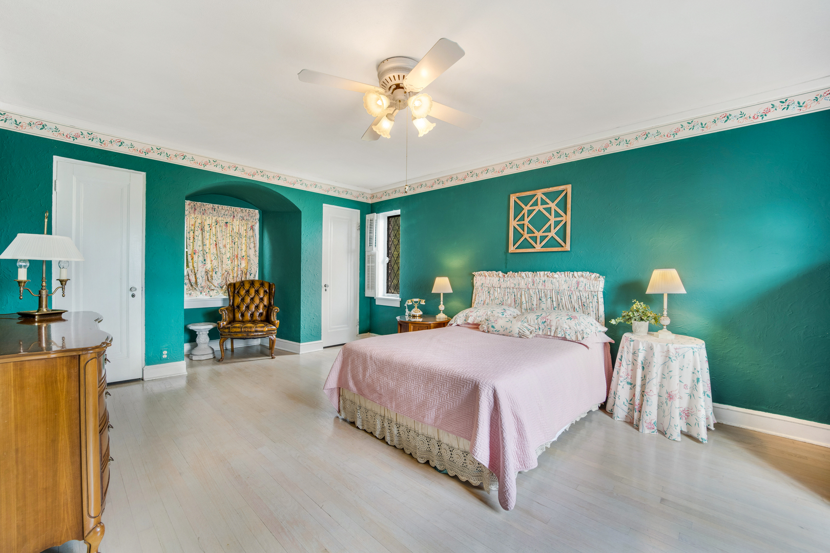 141 North Delaplaine Road Riverside, IL 60546 - Photo 14 of 19 a bedroom with a bed and a chandelier
