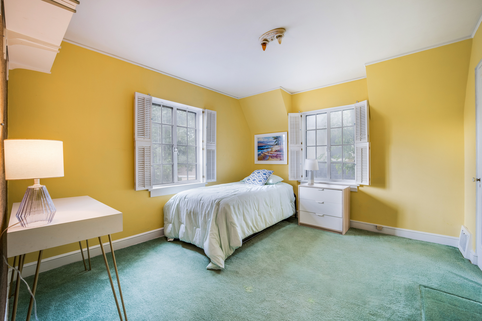 141 North Delaplaine Road Riverside, IL 60546 - Photo 16 of 19 a spacious bedroom with a bed and a table in it