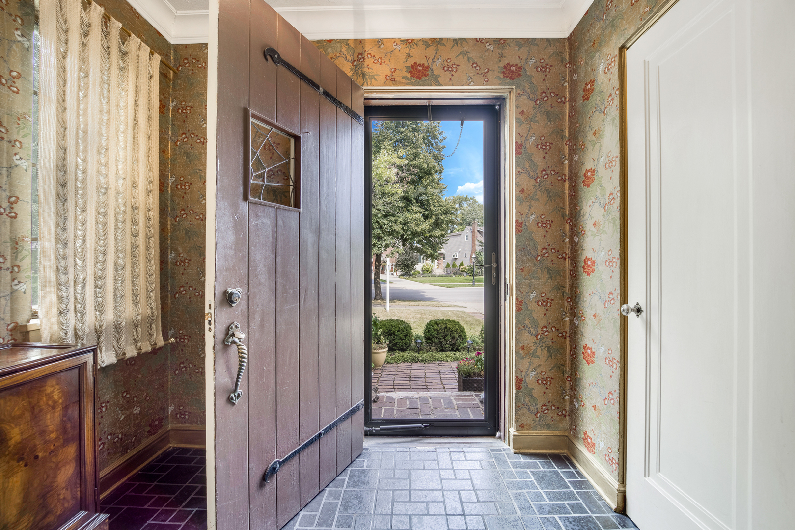 141 North Delaplaine Road Riverside, IL 60546 - Photo 3 of 19 a view of a hallway with a outdoor space