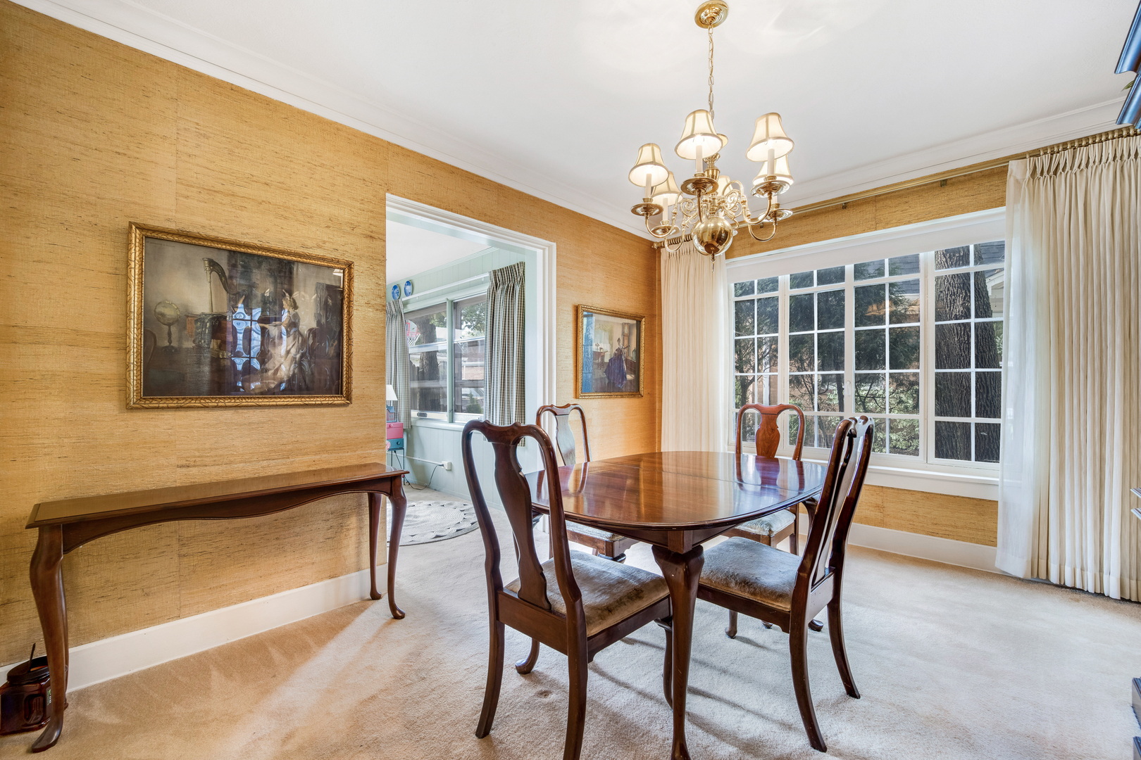 141 North Delaplaine Road Riverside, IL 60546 - Photo 7 of 19 a view of a dining room with furniture and a chandelier