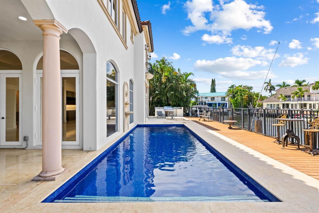 861 Nafa Drive Boca Raton, FL 33487 - Photo 11 of 54 a view of balcony with two chairs and a table