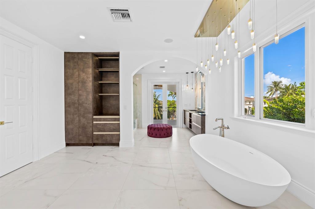 861 Nafa Drive Boca Raton, FL 33487 - Photo 45 of 54 a bathroom with a double vanity sink and a bathtub