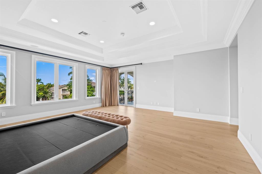 861 Nafa Drive Boca Raton, FL 33487 - Photo 51 of 54 a view of an empty room with window and wooden floor