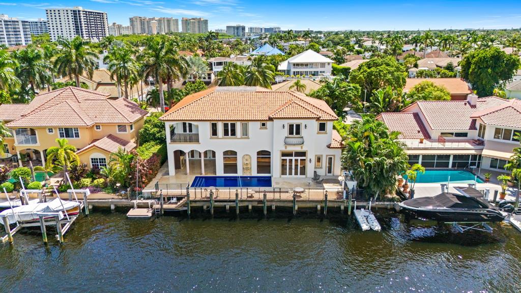861 Nafa Drive Boca Raton, FL 33487 - Photo 6 of 54 a view of a lake with a residential house