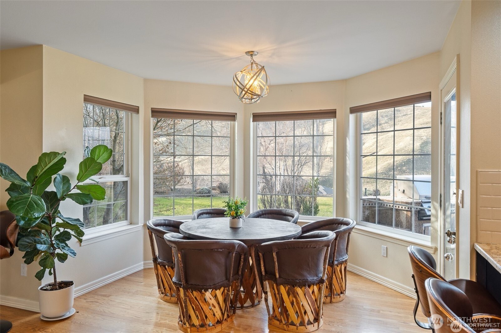 1918 Broadview Wenatchee, WA 98801 - Photo 9 of 38 a dining room with furniture potted plants and wooden floor