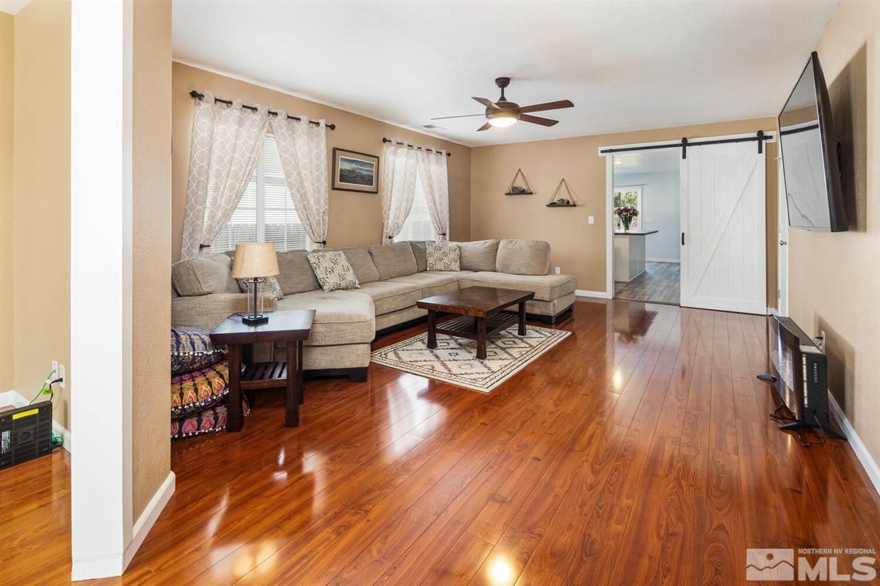 7718 Welsh Drive Reno, NV 89506 - Photo 5 of 25 a living room with furniture and a wooden floor