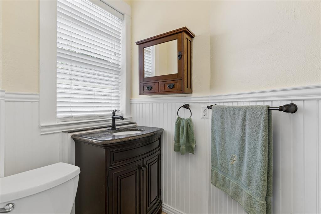 5824 Boone Street Sachse, TX 75048 - Photo 26 of 40 a bathroom with a granite countertop sink toilet and shower