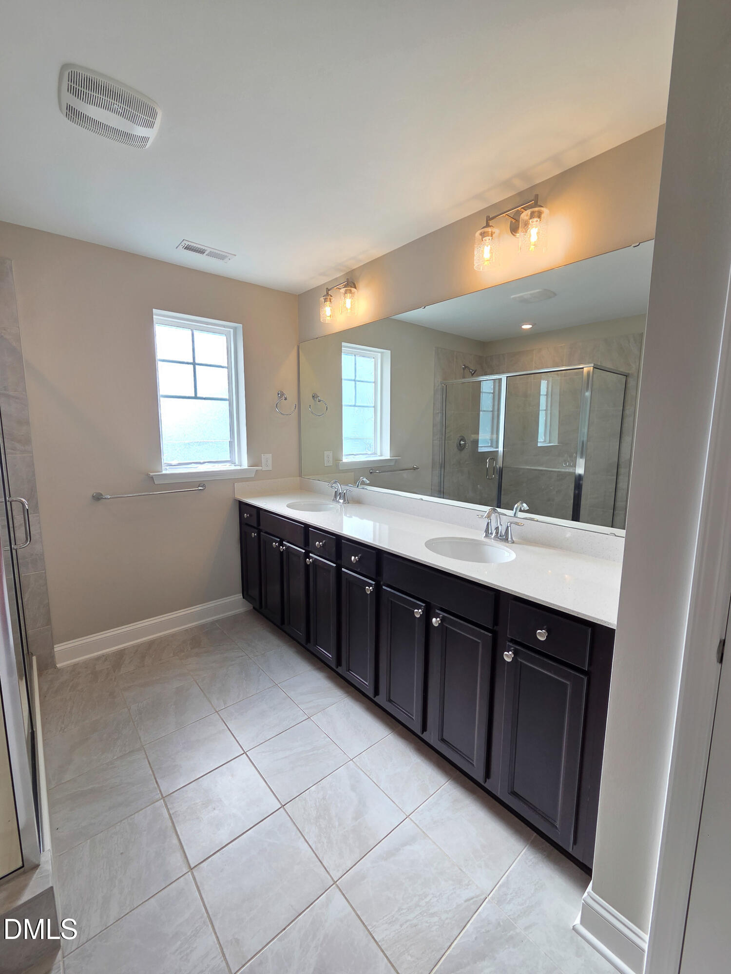 3008 Dunnock Drive Durham, NC 27713 - Photo 21 of 27 a spacious bathroom with a double vanity sink mirror and