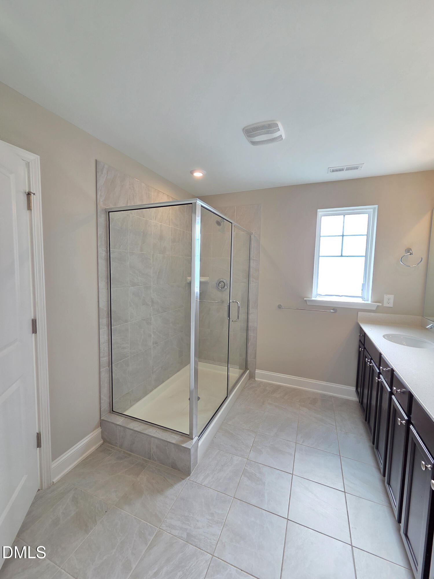3008 Dunnock Drive Durham, NC 27713 - Photo 22 of 27 a view of an empty room with window and chandelier fan