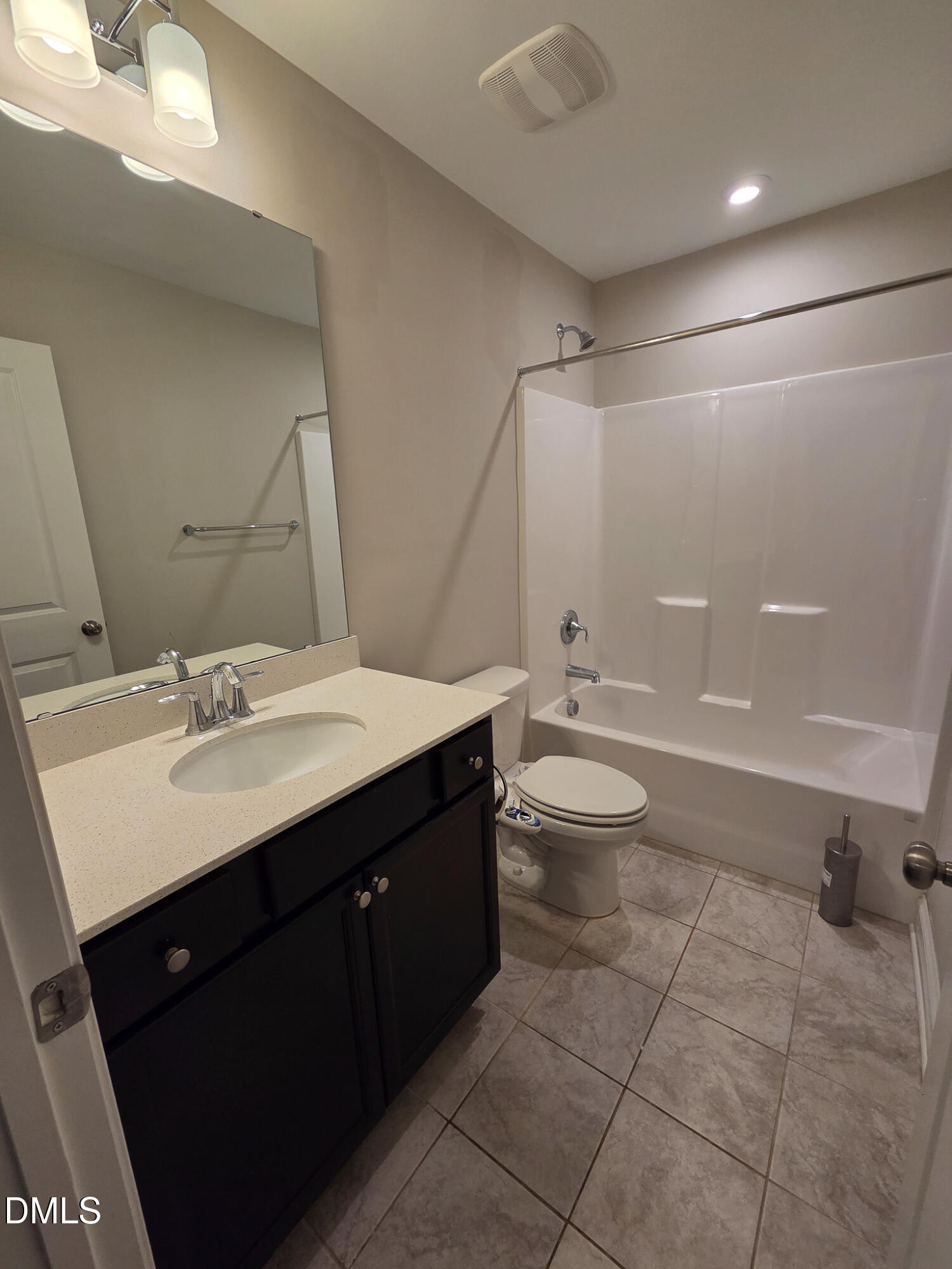 3008 Dunnock Drive Durham, NC 27713 - Photo 24 of 27 a bathroom with a sink a toilet and a large mirror