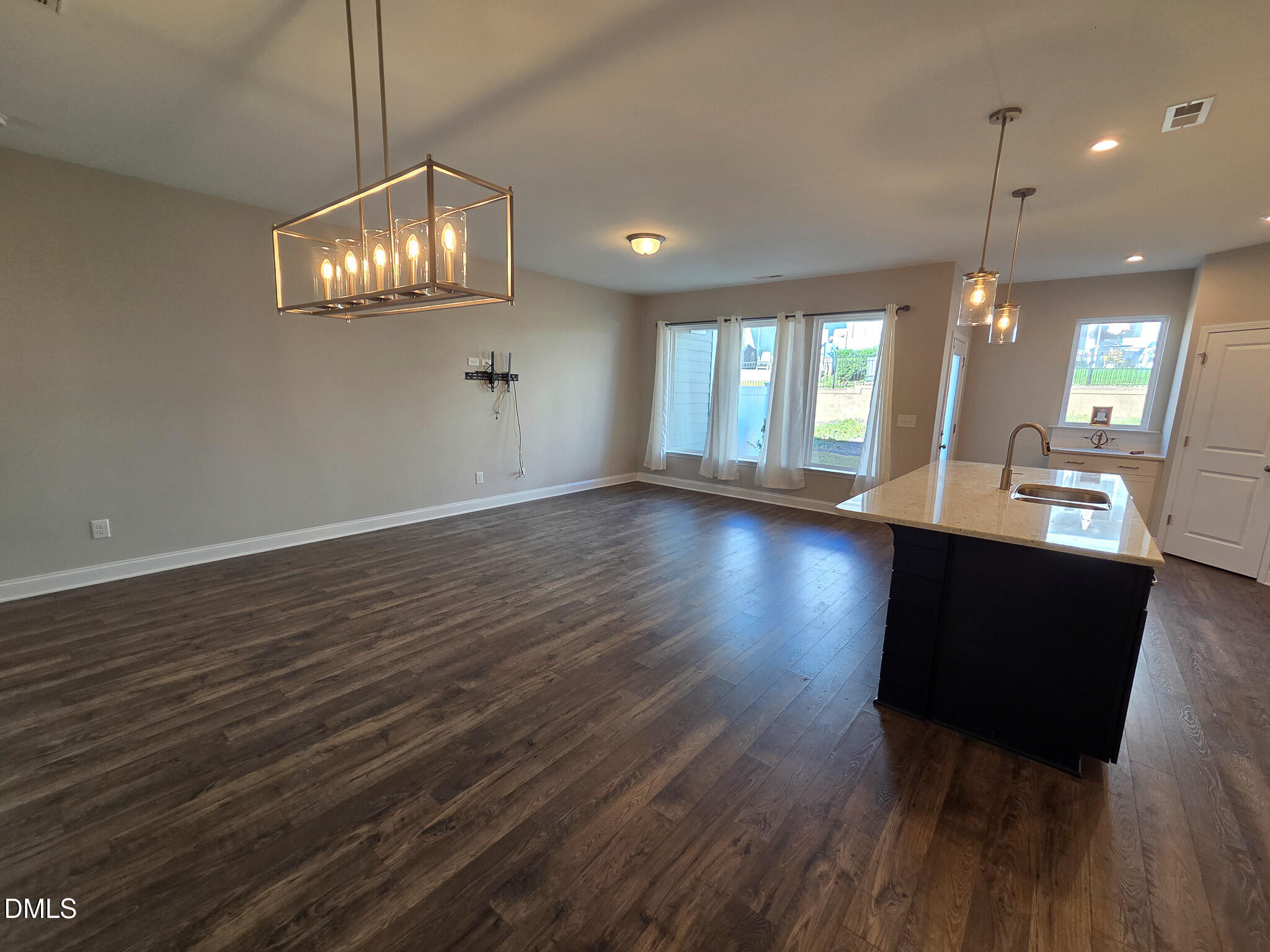 3008 Dunnock Drive Durham, NC 27713 - Photo 5 of 27 a view of a room with wooden floor and chandelier