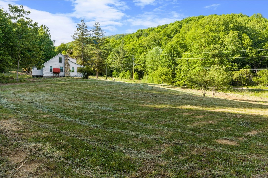 657 Lawrence Greene Road Deep Gap, NC 28618 - Photo 15 of 25 a view of an outdoor space with a lake view
