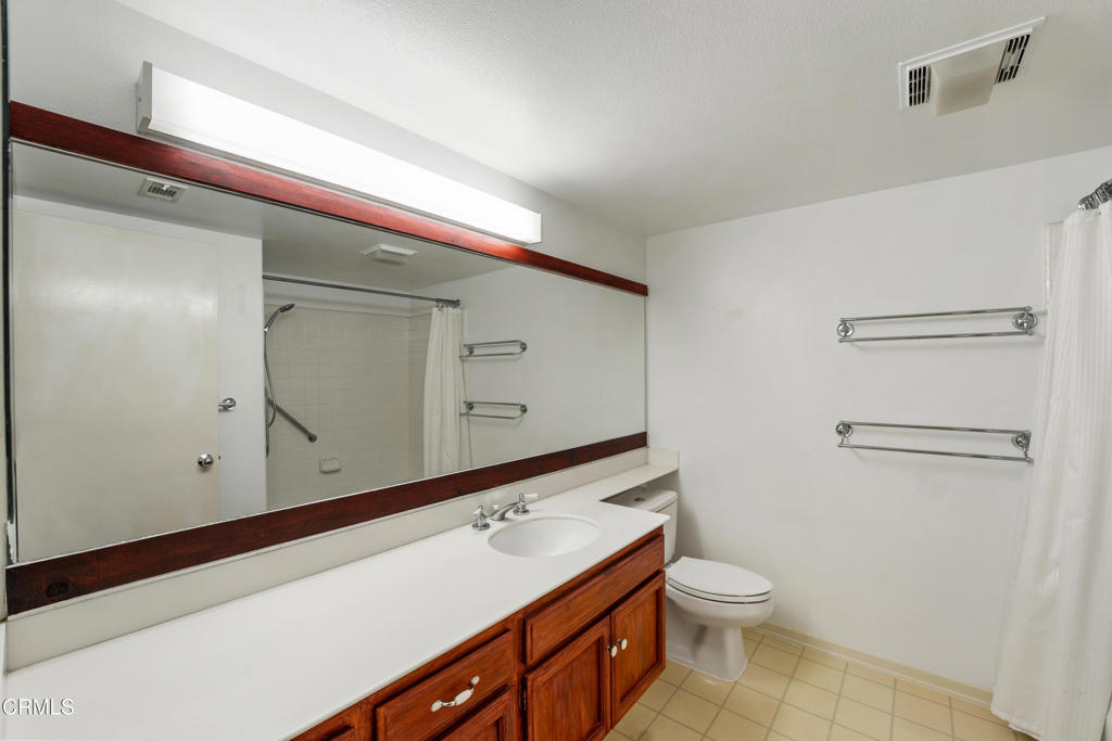 4476 Antigua Way Oxnard, CA 93035 - Photo 22 of 40 a bathroom with a toilet sink and mirror