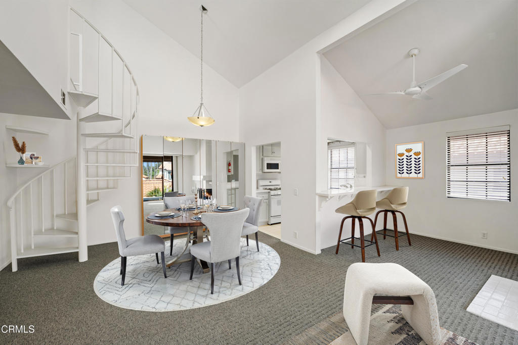 4476 Antigua Way Oxnard, CA 93035 - Photo 7 of 40 a living room with furniture a dining table and a chandelier