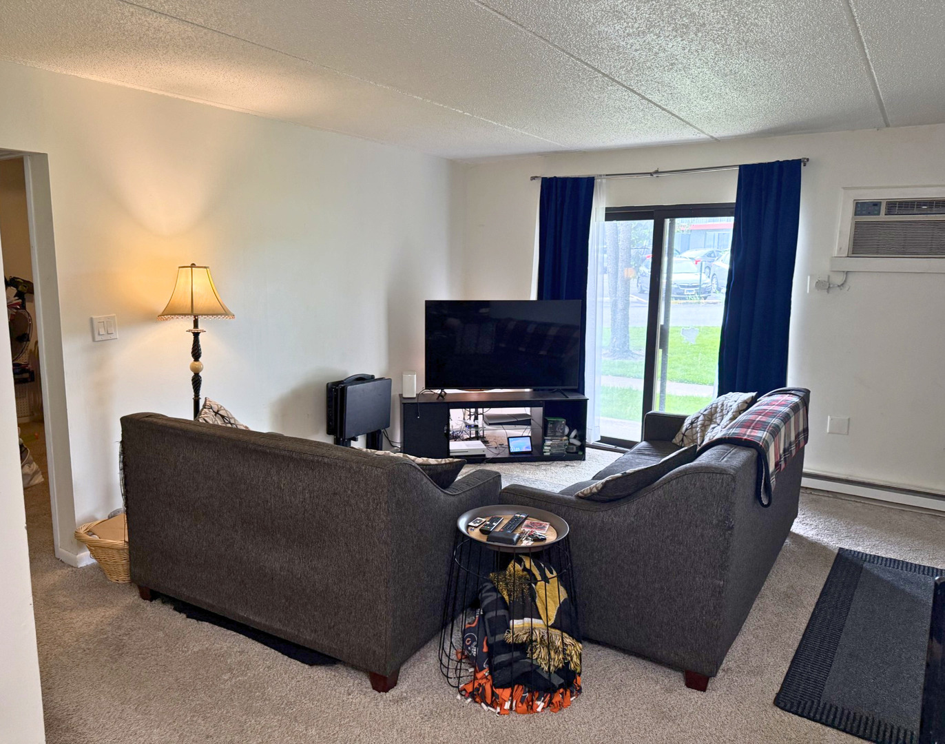 942 North Rohlwing Road, Unit GF Addison, IL 60101 - Photo 3 of 8 a living room with furniture and a flat screen tv