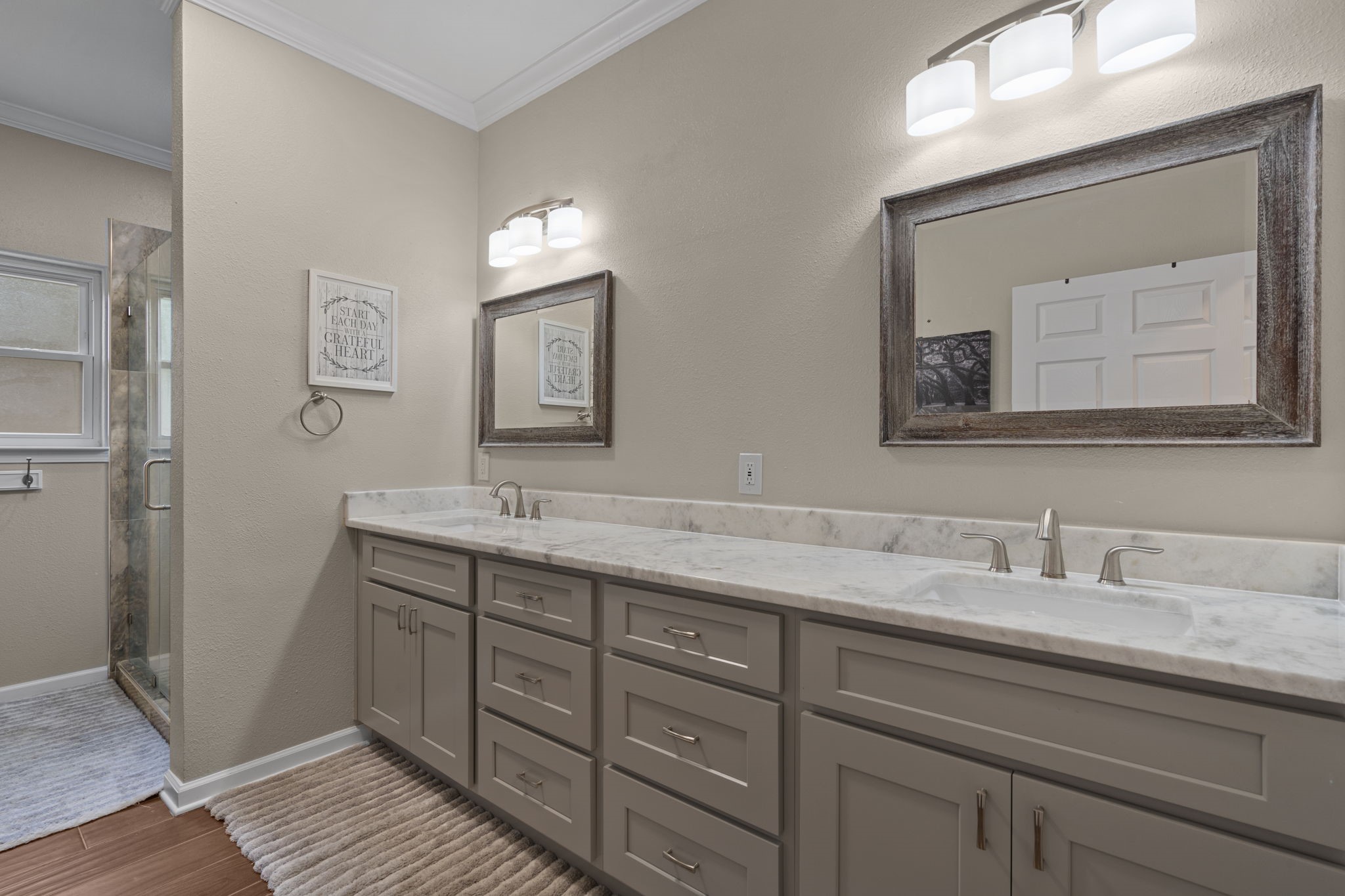 23200 Baneberry Road Magnolia, TX 77355 - Photo 23 of 39 a bathroom with a double vanity sink and a mirror