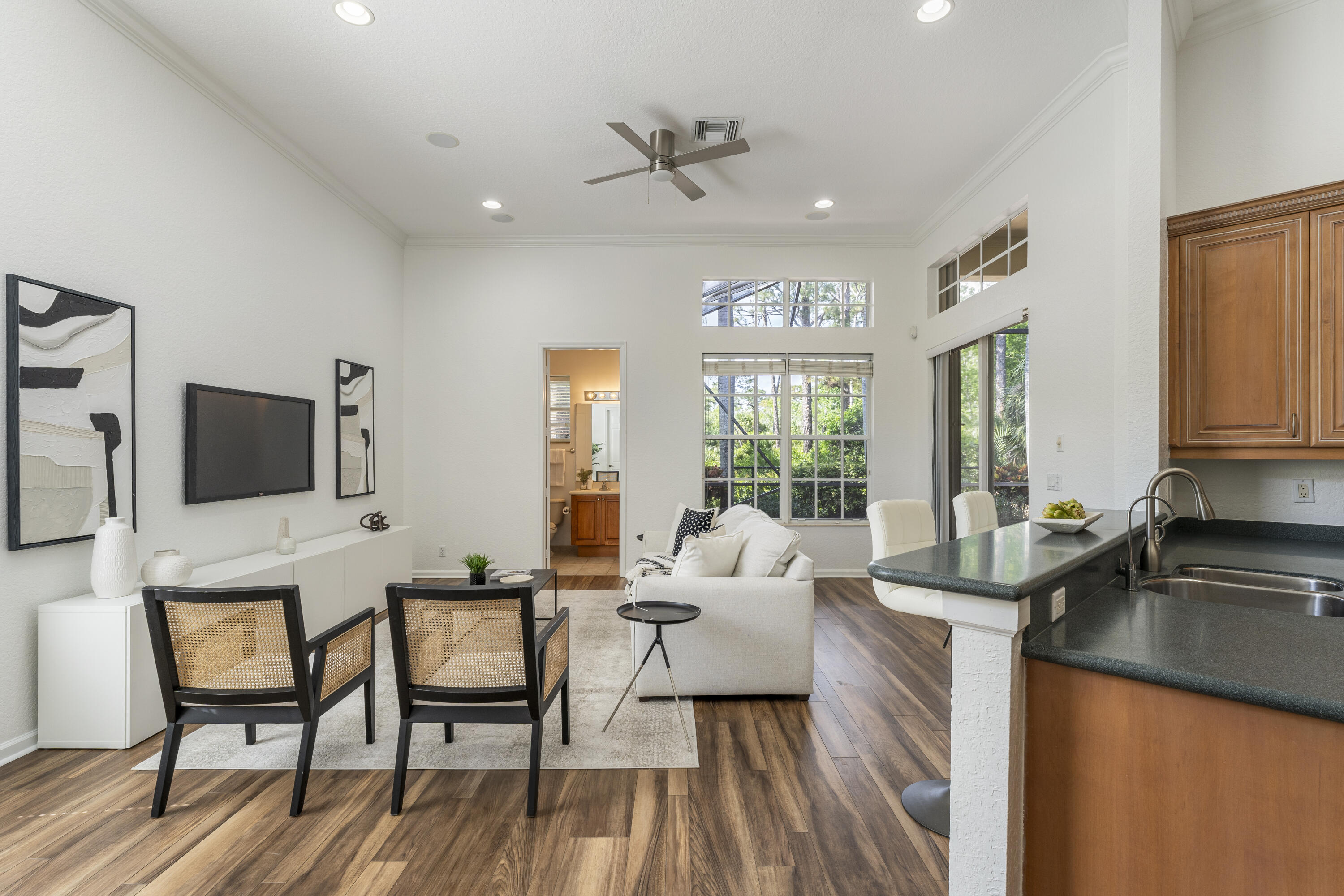 105 Via Bosque Jupiter, FL 33458 - Photo 10 of 34 Kitchen / Family Room / Half Bath