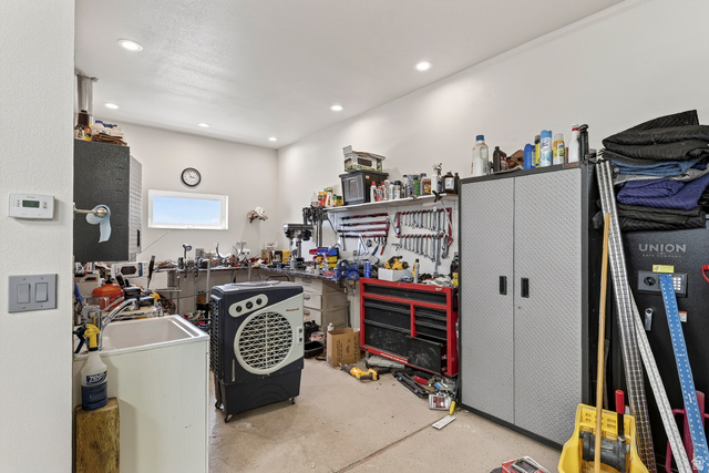 3311 West Allard Summit, UT 84772 - Photo 81 of 97 Utility space featuring a single window, recessed ceiling lighting, a utility sink, and wall-mounted shelving