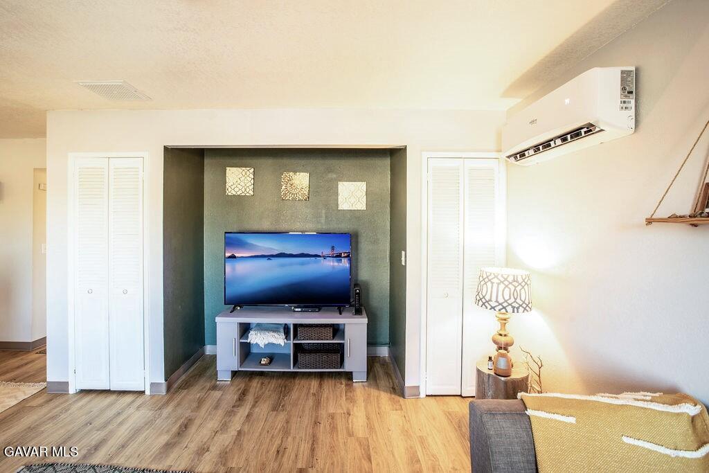 349 South Margalo Street Ridgecrest, CA 93555 - Photo 3 of 14 a living room with furniture and a flat screen tv