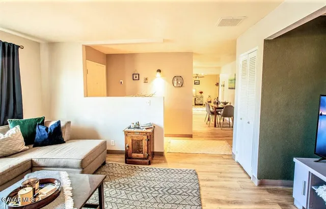 a living room with furniture and a rug