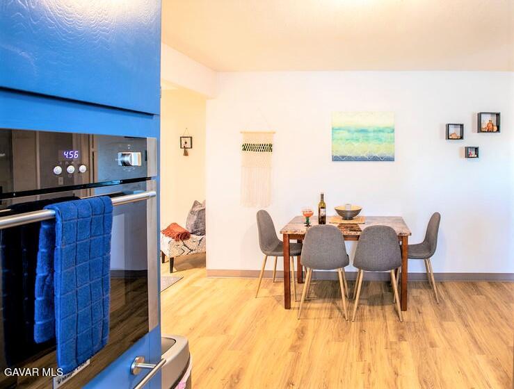 349 South Margalo Street Ridgecrest, CA 93555 - Photo 7 of 14 a dining room with furniture and wooden floor