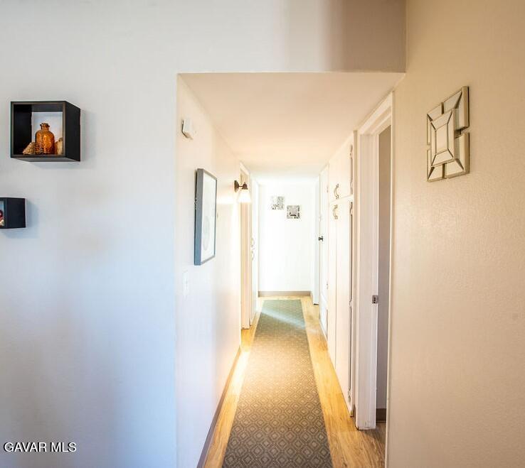 349 South Margalo Street Ridgecrest, CA 93555 - Photo 8 of 14 a view of a bathroom from a hallway