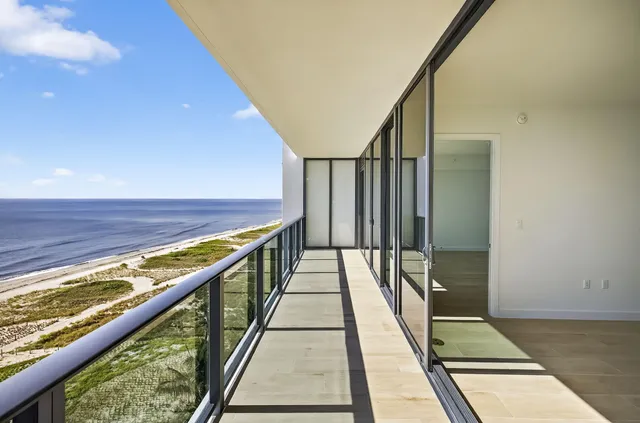 a bathroom with a double vanity sink a large mirror and shower
