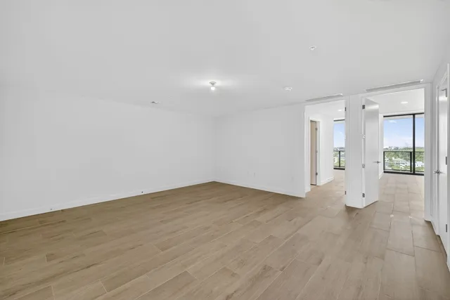 a view of a dining room with furniture and a chandelier