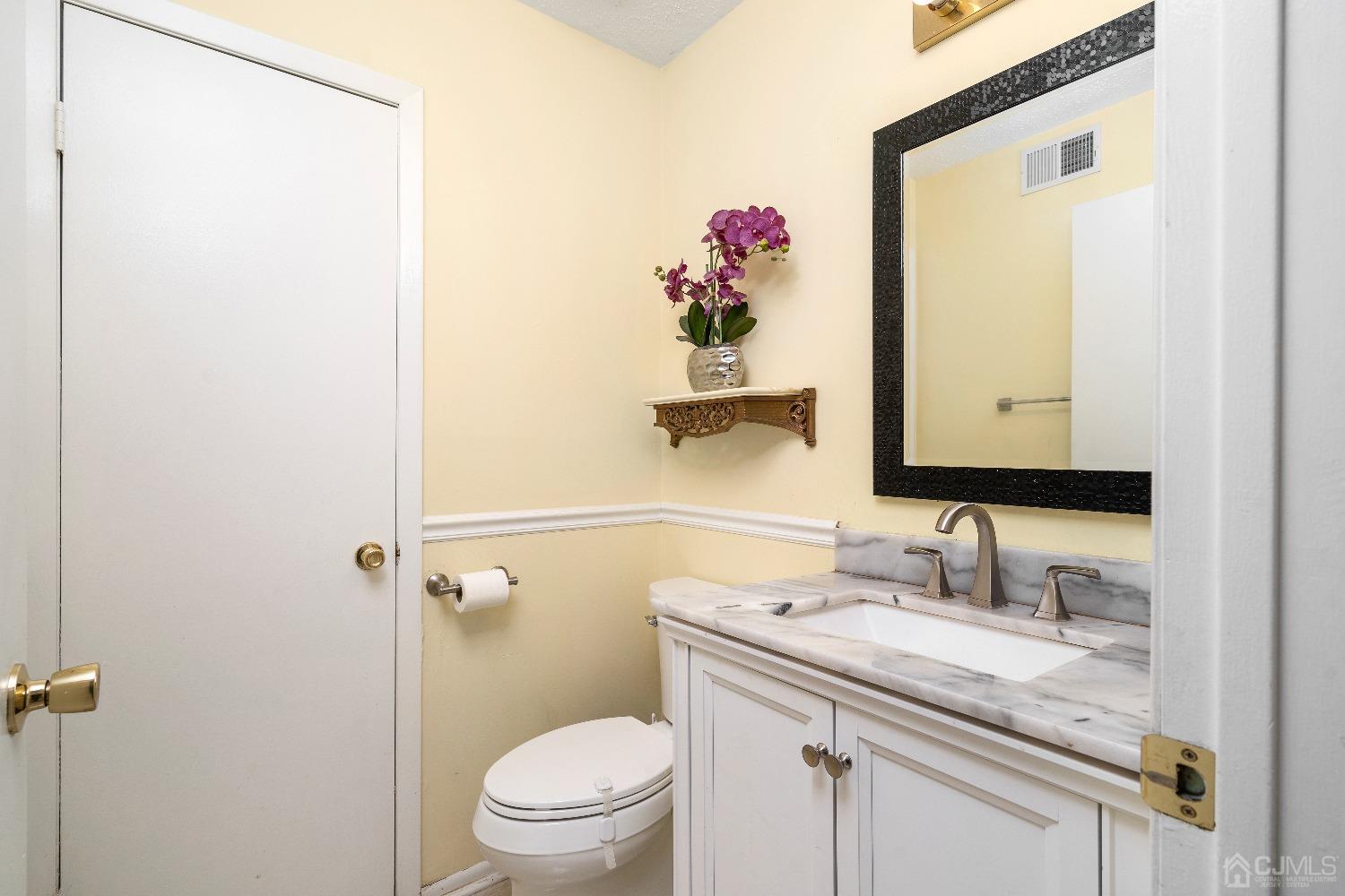 231 Nebula Road Piscataway, NJ 08854 - Photo 13 of 37 a bathroom with a granite countertop sink and a mirror