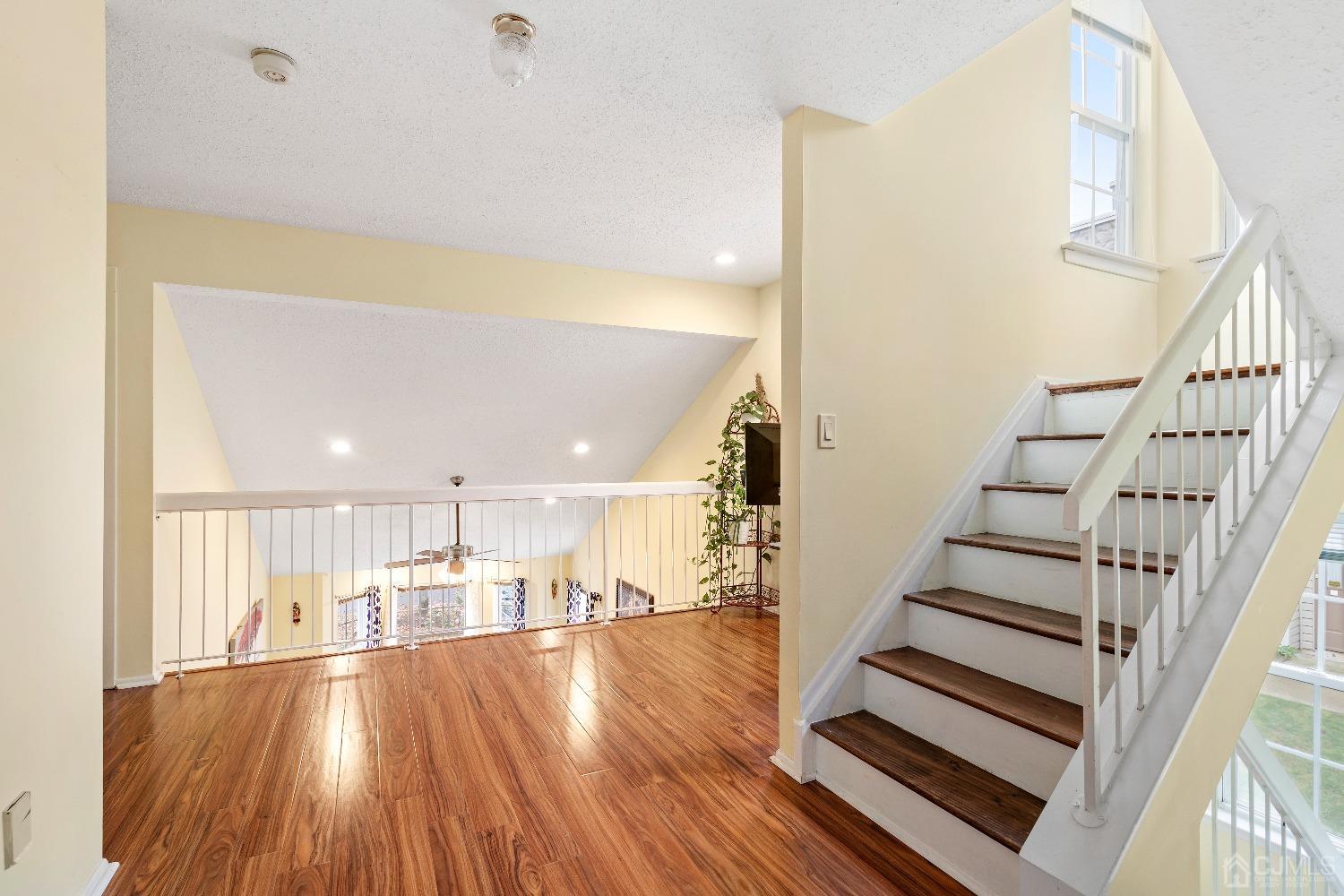 231 Nebula Road Piscataway, NJ 08854 - Photo 14 of 37 a view of entryway and kitchen with wooden floor