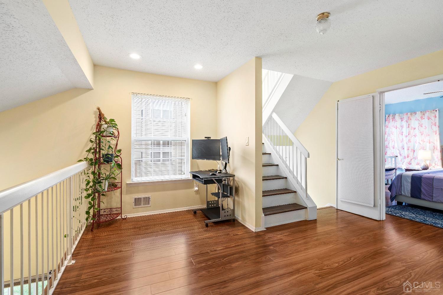 231 Nebula Road Piscataway, NJ 08854 - Photo 15 of 37 a view of entryway with wooden floor and stairs