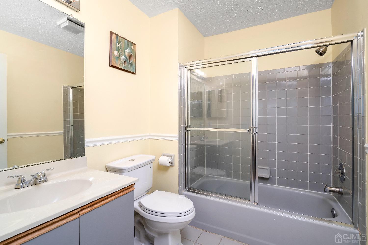231 Nebula Road Piscataway, NJ 08854 - Photo 20 of 37 a bathroom with a shower and a toilet sink