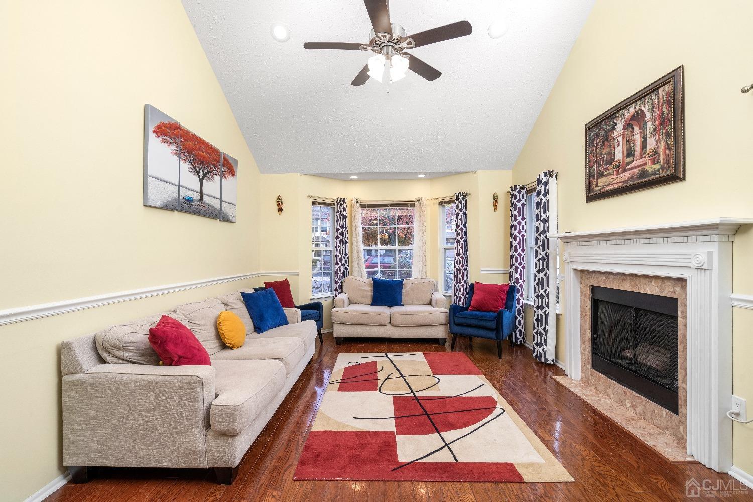 231 Nebula Road Piscataway, NJ 08854 - Photo 3 of 37 a living room with furniture and a fireplace