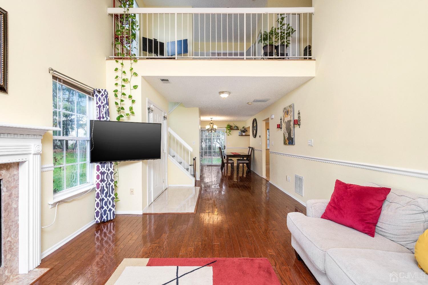 231 Nebula Road Piscataway, NJ 08854 - Photo 5 of 37 a living room with furniture and a flat screen tv