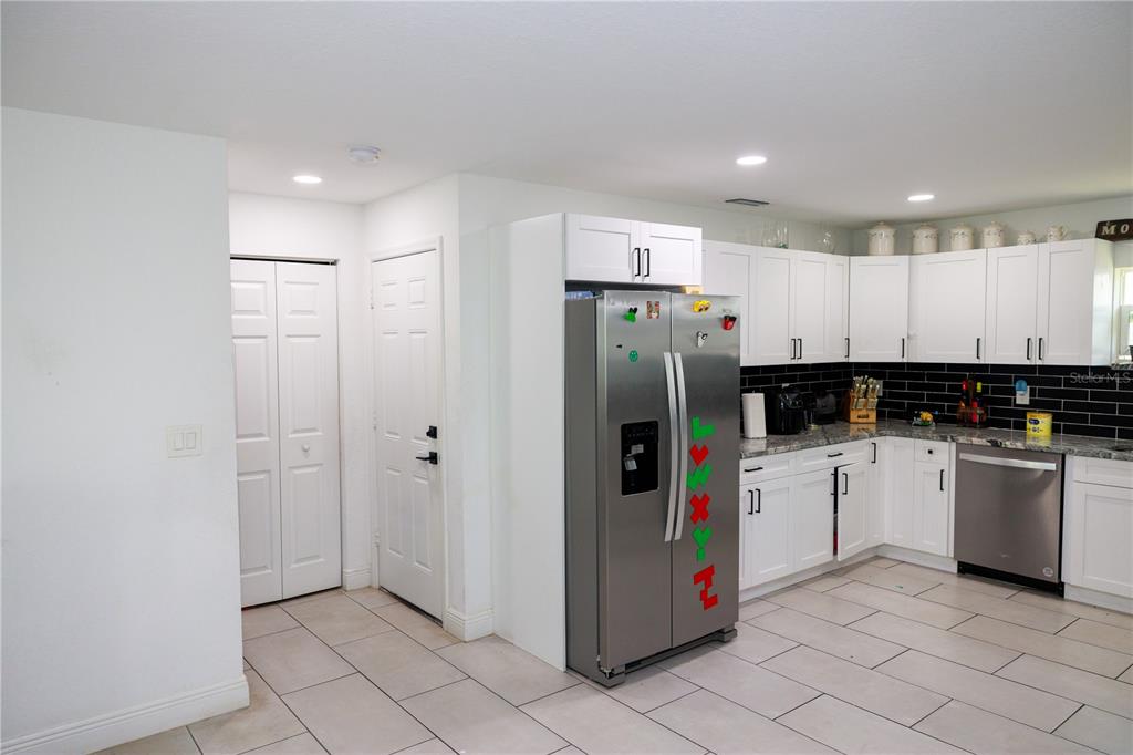 5112 Pacific Spring Hill, FL 34606 - Photo 13 of 13 a kitchen with refrigerator and cabinets