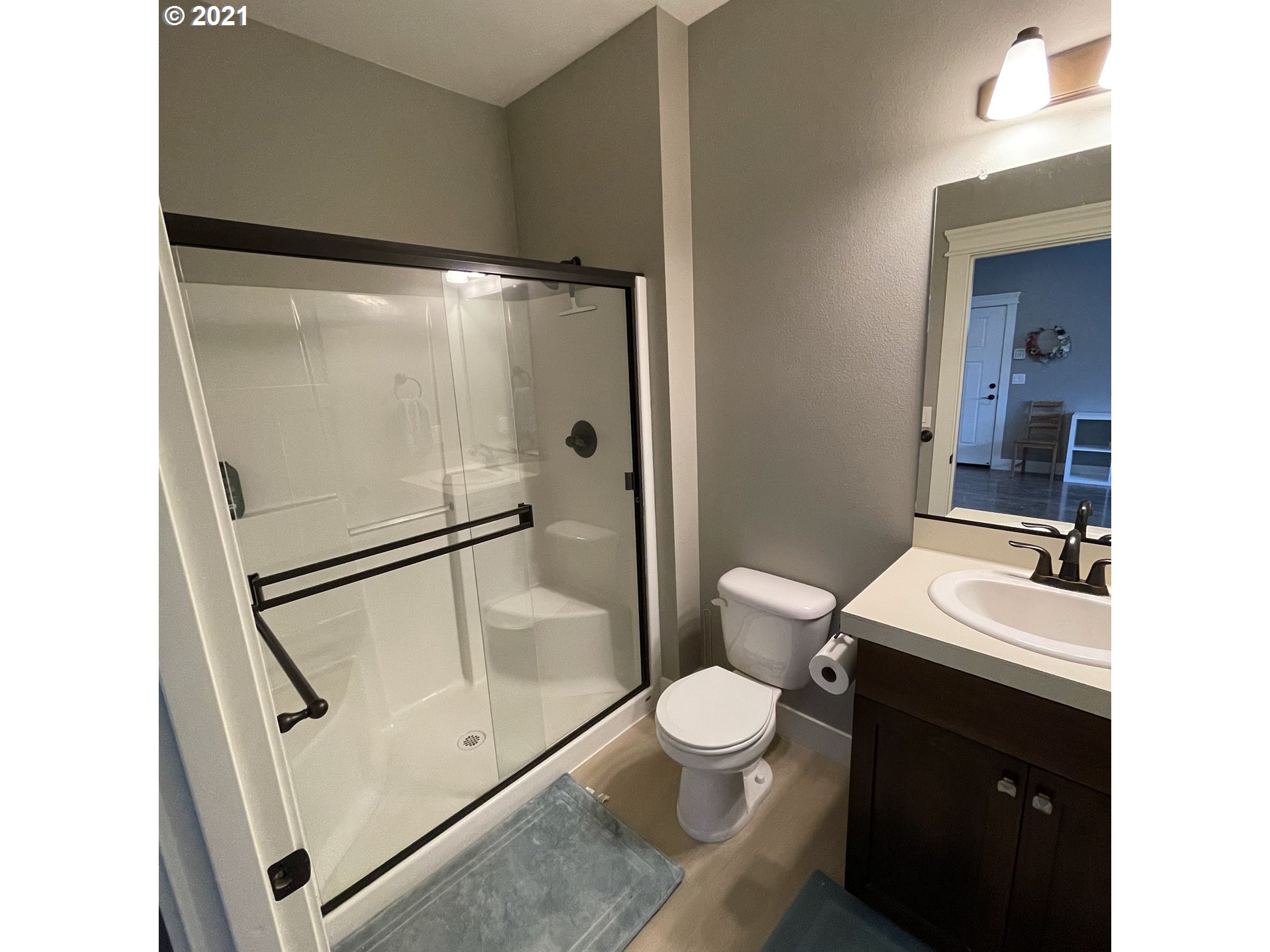 4552 North 9th Street Ridgefield, WA 98642 - Photo 11 of 29 a bathroom with a toilet a sink and a shower