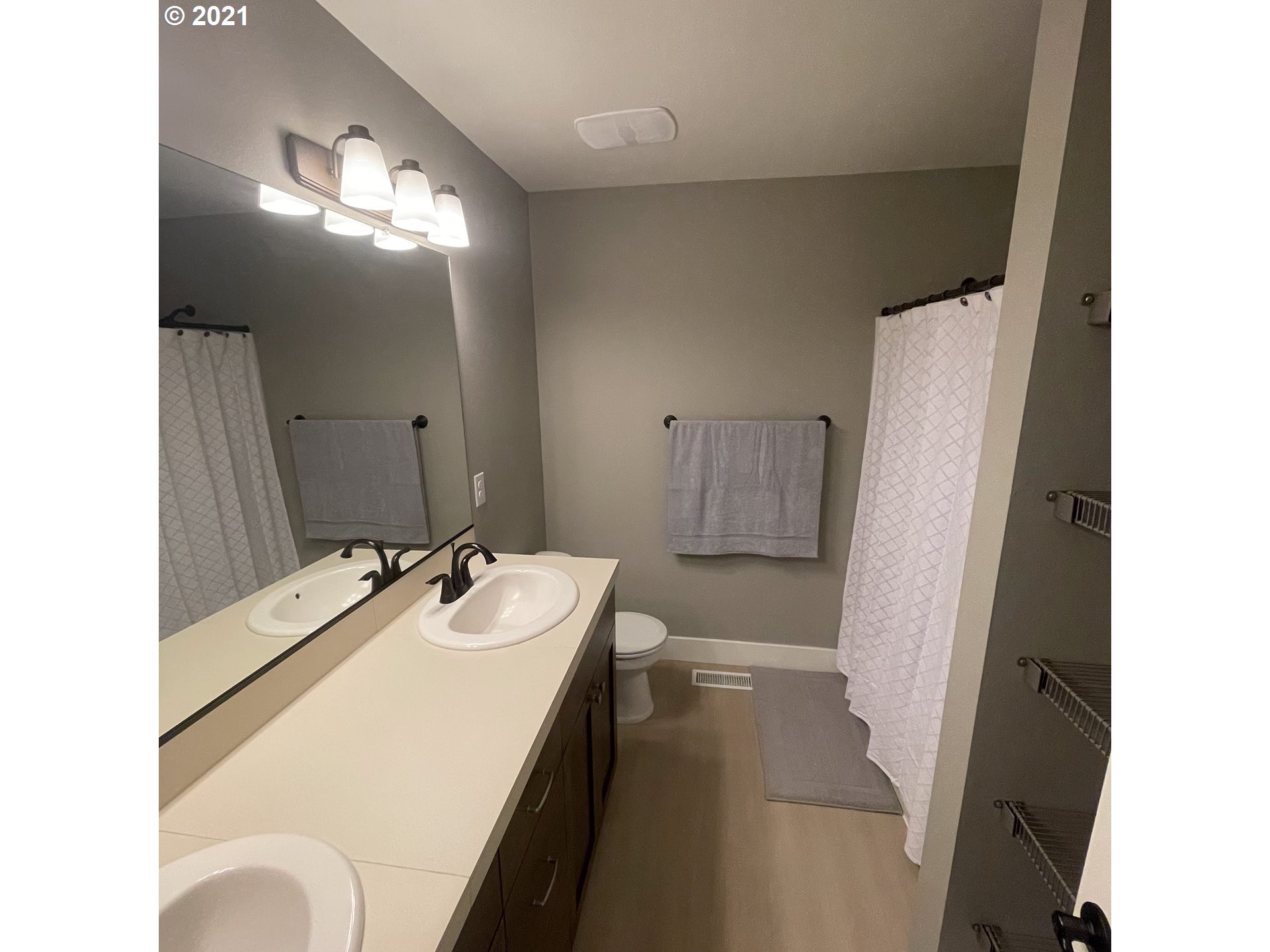 4552 North 9th Street Ridgefield, WA 98642 - Photo 15 of 29 a bathroom with a sink and a mirror