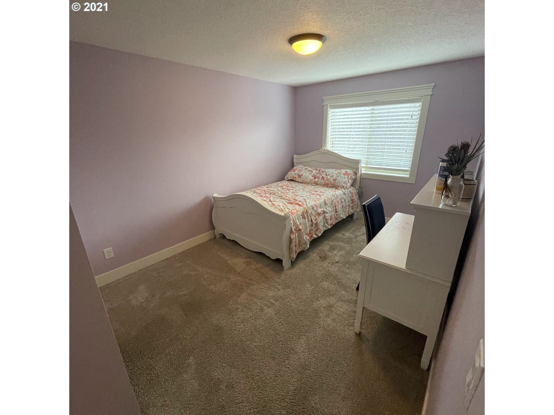 4552 North 9th Street Ridgefield, WA 98642 - Photo 19 of 29 a bedroom with a bed and a couch