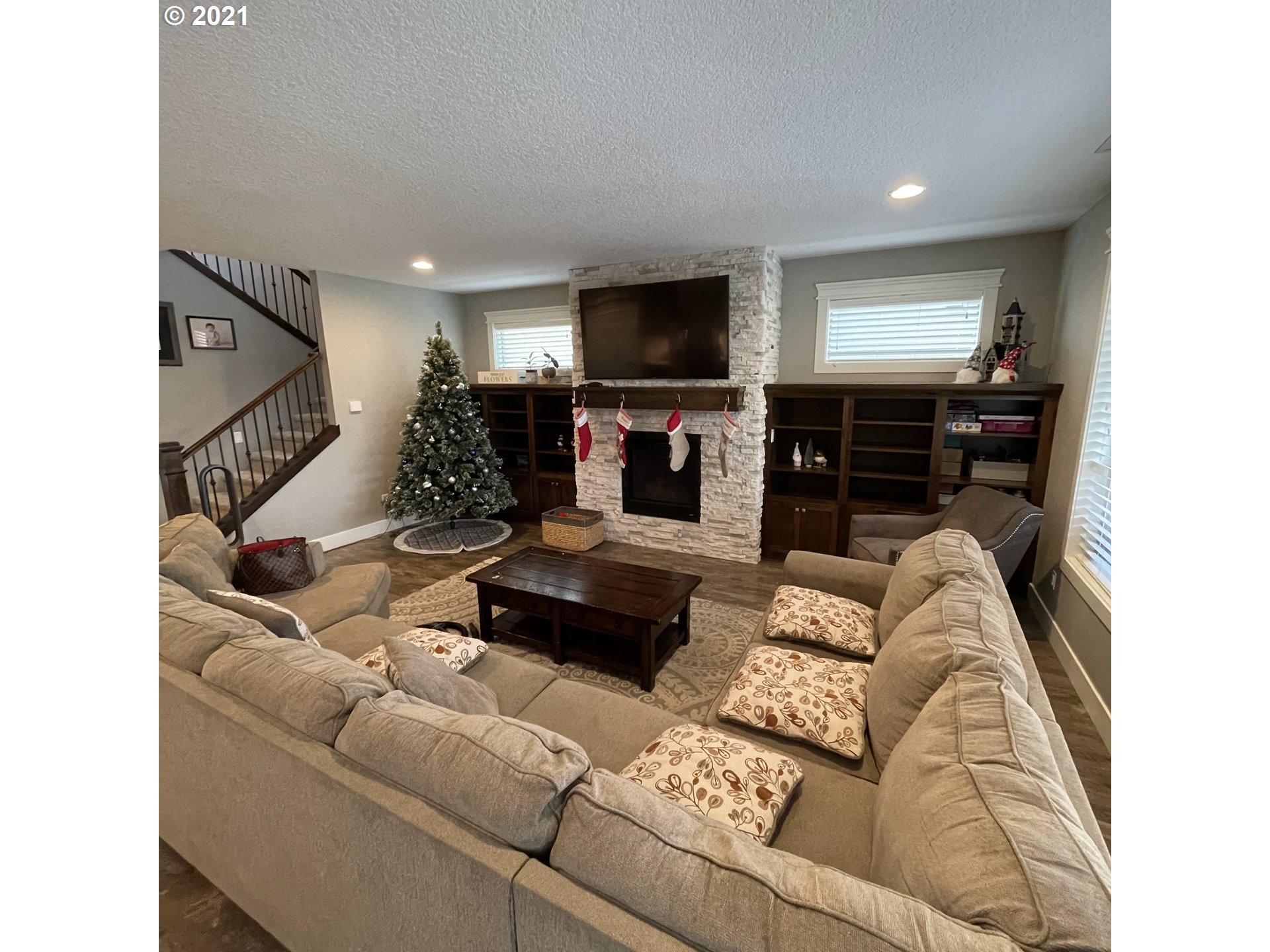 4552 North 9th Street Ridgefield, WA 98642 - Photo 4 of 29 a living room with furniture and a flat screen tv