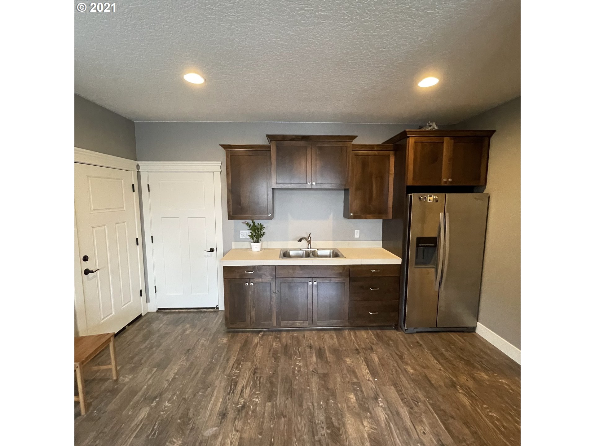 4552 North 9th Street Ridgefield, WA 98642 - Photo 10 of 29 a view of kitchen with refrigerator sink and cabinets