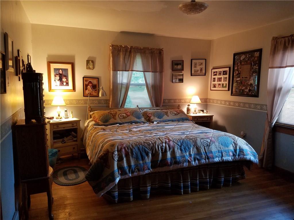 Master Bedroom with lots of natural light and beautiful hardwood floor. 