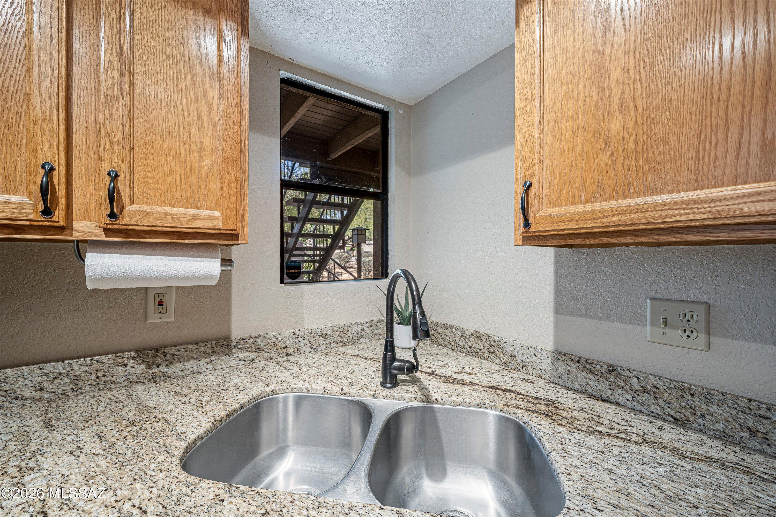 5800 North Kolb Road, Unit 5125 Tucson, AZ 85750 - Photo 11 of 34 a kitchen with a sink and a window